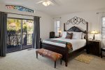 The master bedroom has a gorgeous ornate queen size bed